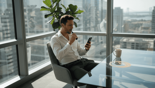 Professional vaping in bright corner office